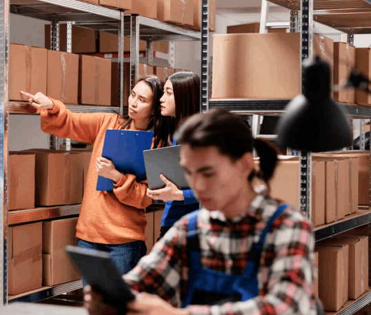 Transport operator checking freight in a warehouse
